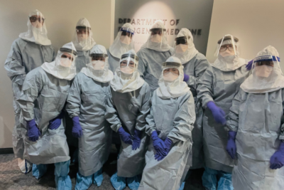 A group of nurses in full PPE